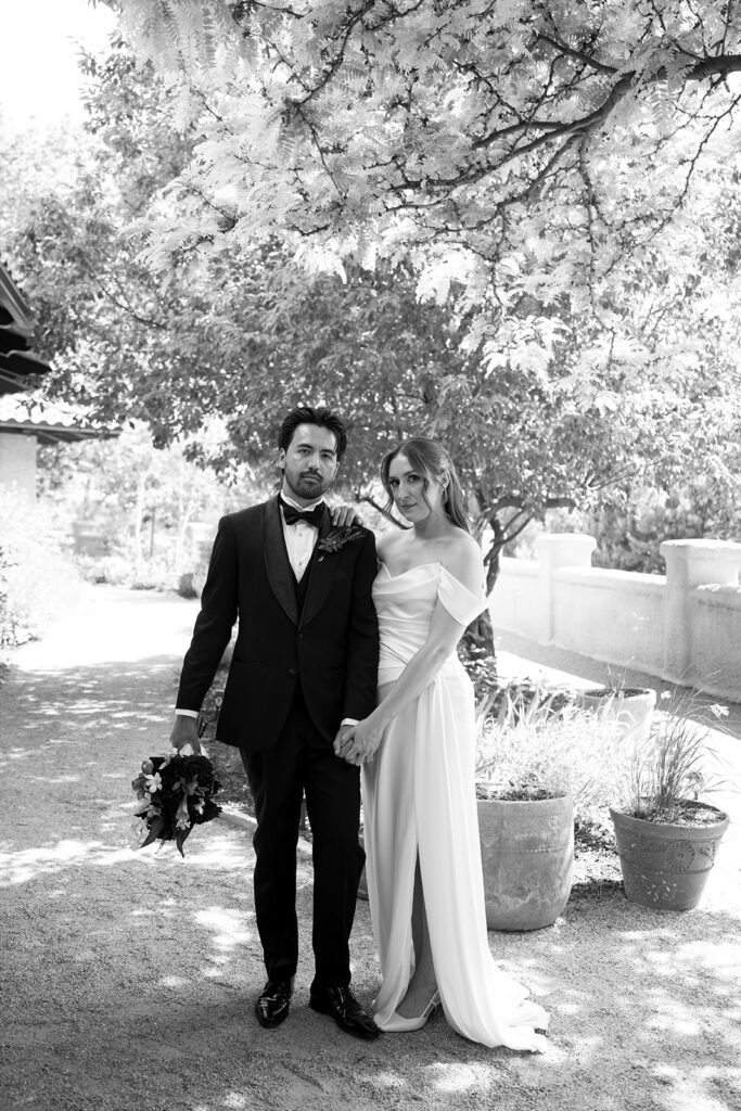 bride and groom posing in the courtyard of villa parker